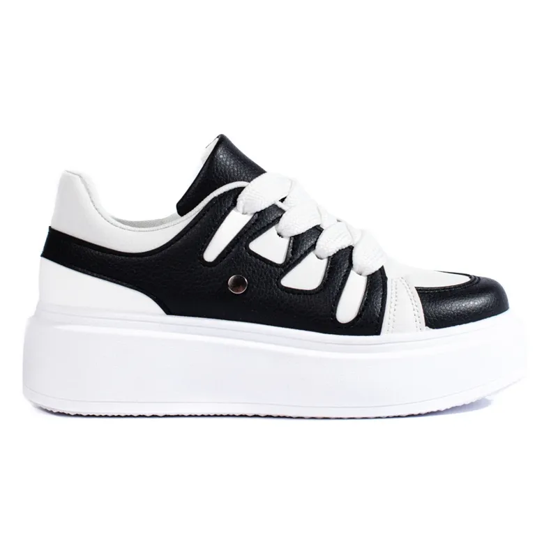 Black and white women's sneakers from Shelovet with a thick sole