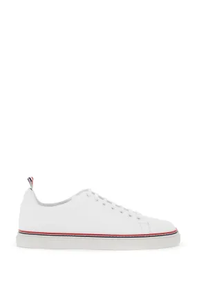 Thom Browne smooth leather sneakers with tricolor detail.